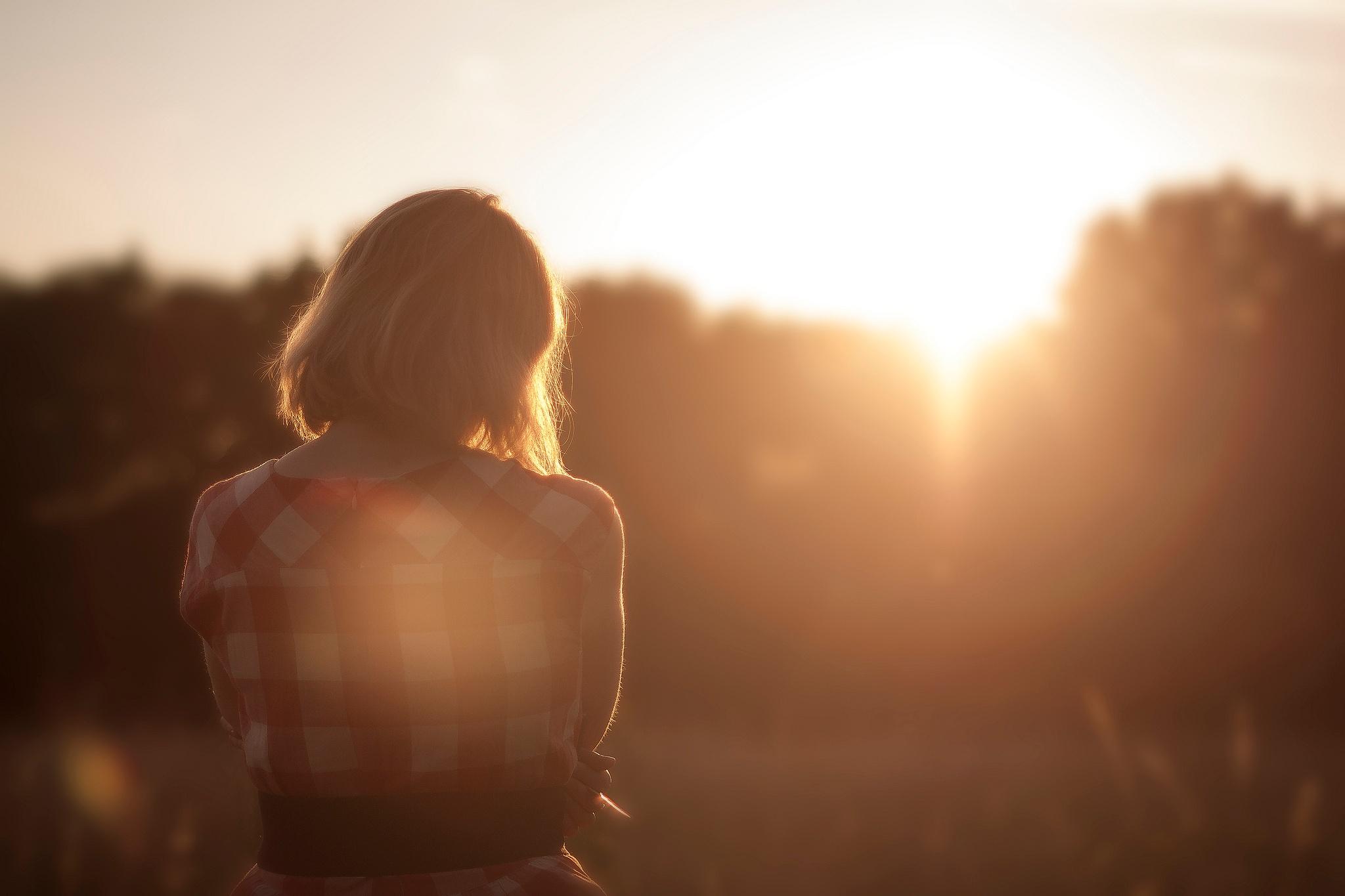 The girl watching the sunset