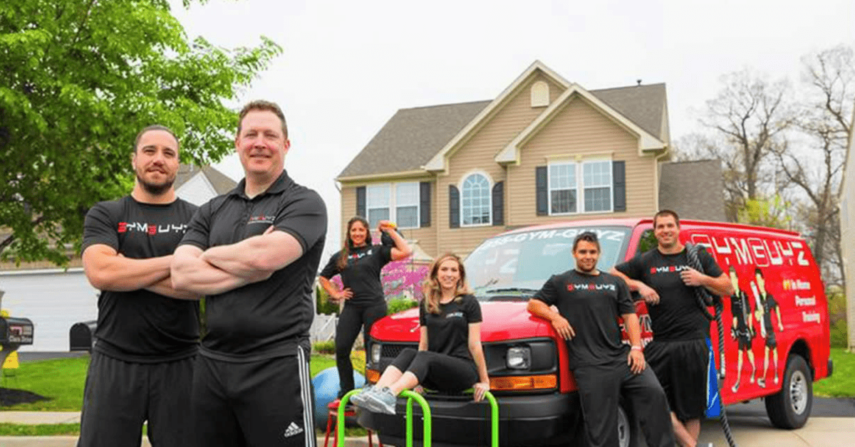 gym guyz staff outside their van